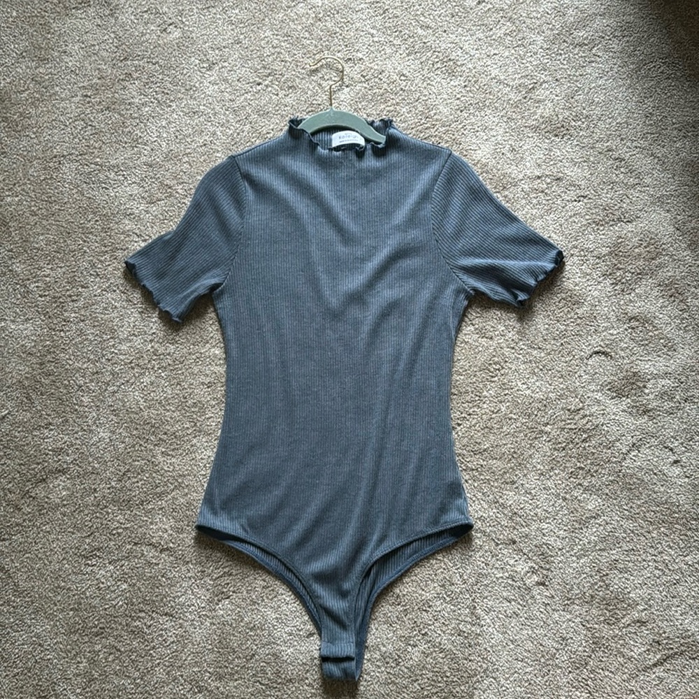 Kaileigh blue high-neck body suit.
